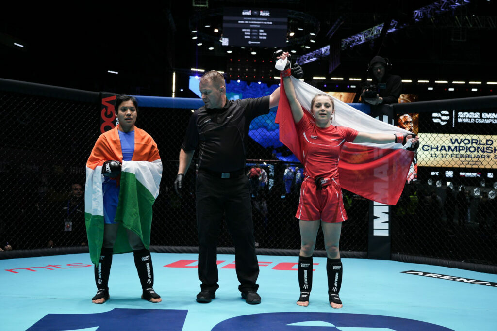 Polish fighter gets her hand raised as she wins her bout at the 2022 IMMAF World Championships