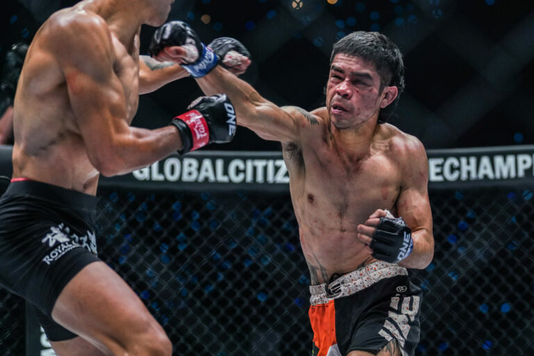 Danial Williams throws a punch inside the ONE cage.