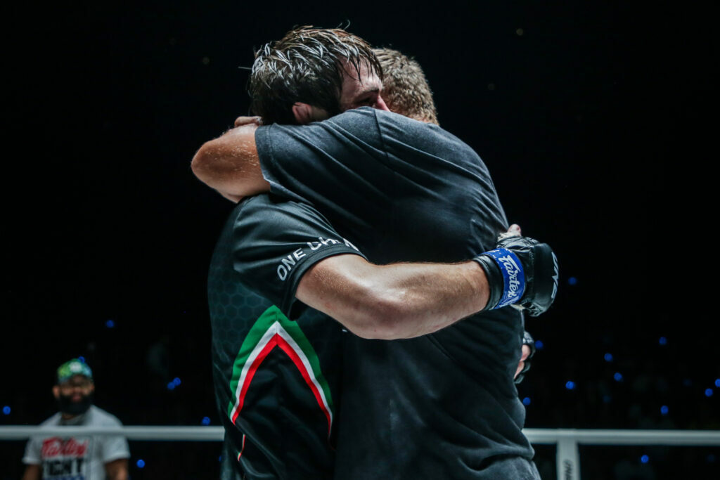 Ibragim Dauev hugs Anatoly Malykhin