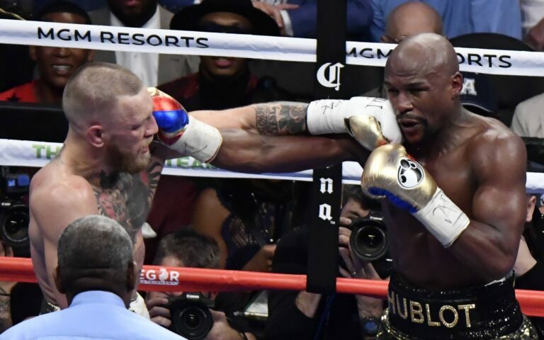 Conor McGregor and Floyd Mayweather land punches