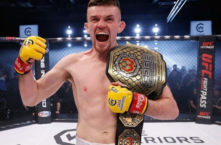 Harry Hardwick celebrates his Cage Warriors title win