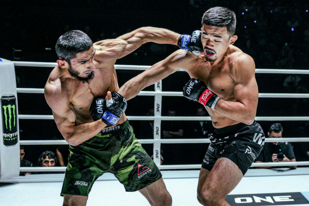 Alibeg Rasulov punches Christian Lee