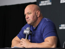 Dana White holding a microphone at UFC Apex venue - sports wagering in MMA