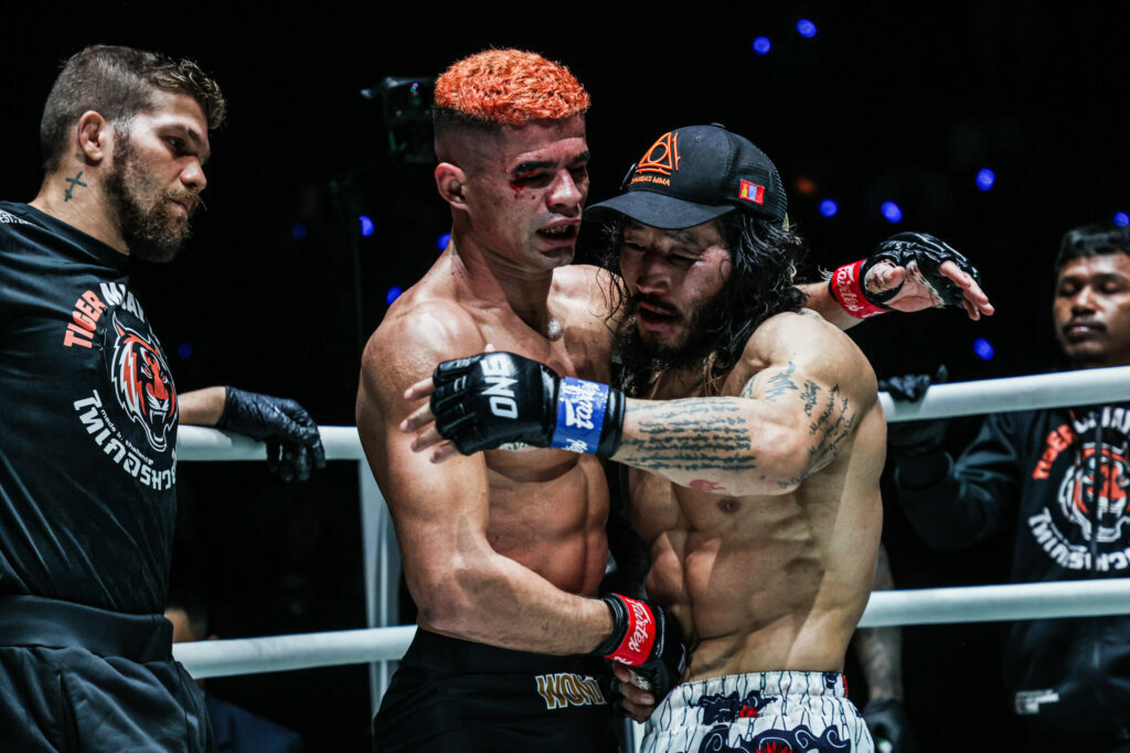 Brazilian MMA fighter Fabricio Andrade congratulates Enkh-Orgil Baatarkhuu following their MMA World Title fight
