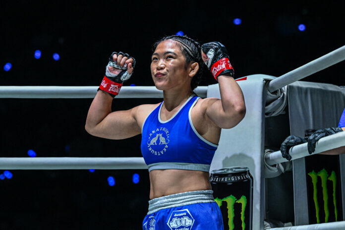 Atomweight MMA fighter Chihiro Sawada poses in the ring corner